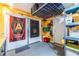 Organized basement featuring garage door access, shelving, and Atlanta United FC memorabilia at 104 Powell Cv, Decatur, GA 30030