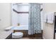 Stylish bathroom showcasing a shower-tub combo with decorative tile accents and a modern vanity at 104 Powell Cv, Decatur, GA 30030