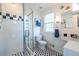 Modern bathroom with glass shower, white subway tile, and black and white hexagon floor at 104 Powell Cv, Decatur, GA 30030
