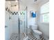 Modern bathroom with glass shower, white subway tile, and black and white hexagon floor at 104 Powell Cv, Decatur, GA 30030