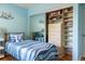 Well-organized bedroom with a closet system and a mirrored sliding closet at 104 Powell Cv, Decatur, GA 30030