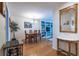 Inviting dining room with wood floors, table for six, and built-in shelving creating a cozy atmosphere at 104 Powell Cv, Decatur, GA 30030
