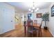 Bright dining area features bamboo floors, modern light fixture, and adjacent kitchen for easy access at 104 Powell Cv, Decatur, GA 30030