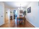 Bright dining area features bamboo floors, modern light fixture, and adjacent kitchen for easy access at 104 Powell Cv, Decatur, GA 30030