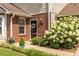 Charming brick front exterior featuring a well-manicured lawn and beautiful landscaping at 104 Powell Cv, Decatur, GA 30030
