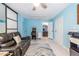 Game room with an arcade game, light blue walls, a ceiling fan, and a doorway that leads to another room at 104 Powell Cv, Decatur, GA 30030