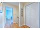Light and airy hallway with hardwood floors leads to a bedroom and has access to a closet at 104 Powell Cv, Decatur, GA 30030