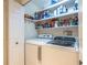 Functional laundry room featuring a washer and dryer, complemented by ample shelving for storage at 104 Powell Cv, Decatur, GA 30030