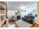 Living room features a fireplace, comfortable seating, hardwood floors, and built-in shelving at 104 Powell Cv, Decatur, GA 30030
