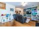 Open-concept living room featuring hardwood floors, comfortable seating, and direct access to the dining room at 104 Powell Cv, Decatur, GA 30030