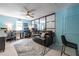 Spacious office with light blue walls, a ceiling fan, and a large mirror wall to make the room feel even bigger at 104 Powell Cv, Decatur, GA 30030