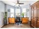 Bright office space with lots of natural light and a built-in desk with wooden cabinets, great for working from home at 104 Powell Cv, Decatur, GA 30030