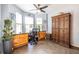 Bright office space with lots of natural light and a built-in desk with wooden cabinets, great for working from home at 104 Powell Cv, Decatur, GA 30030