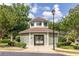 Inviting pool entrance area featuring a covered gazebo, lush landscaping, and a secure gate at 104 Powell Cv, Decatur, GA 30030