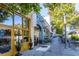 A vibrant retail storefront with outdoor seating, set in a walkable, tree-lined business district at 104 Powell Cv, Decatur, GA 30030
