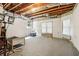 Unfinished basement featuring natural light from windows and open ceiling at 1213 Grande Vw, Loganville, GA 30052