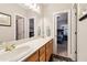 Bathroom featuring a double sink vanity and a doorway leading to the bedroom at 1213 Grande Vw, Loganville, GA 30052