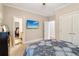 Bedroom with a tv mounted on the wall, with direct access to the ensuite bathroom at 1213 Grande Vw, Loganville, GA 30052