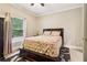 Bedroom with a bed with patterned bedding, and natural light from the window at 1213 Grande Vw, Loganville, GA 30052