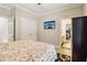 Bedroom with a tv mounted on the wall, and a doorway leading to the ensuite bathroom at 1213 Grande Vw, Loganville, GA 30052