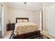 Bedroom features a bed with patterned bedding, and natural light from the window at 1213 Grande Vw, Loganville, GA 30052