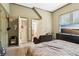 Cozy carpeted bedroom with ample closet space, large window and modern decor at 1213 Grande Vw, Loganville, GA 30052