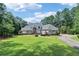 Stately home with beautiful landscaping and a circular driveway at 1213 Grande Vw, Loganville, GA 30052