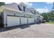 This residence offers a spacious three-car garage, providing ample parking and storage solutions at 1213 Grande Vw, Loganville, GA 30052