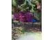 Landscaped garden featuring vibrant purple azaleas with a decorative wrought iron archway at 1213 Grande Vw, Loganville, GA 30052
