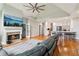 Open-concept living room with fireplace, high ceiling, and adjacent kitchen at 1213 Grande Vw, Loganville, GA 30052