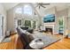 Living room featuring a fireplace, large windows and a view to the outside at 1213 Grande Vw, Loganville, GA 30052