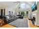 Spacious living room with fireplace, large windows, and a comfortable sectional sofa at 1213 Grande Vw, Loganville, GA 30052