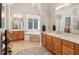A spa-like main bathroom with double sinks, a soaking tub, and tile flooring at 1213 Grande Vw, Loganville, GA 30052