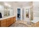 Bright main bathroom with double vanity, walk-in shower, and serene decor at 1213 Grande Vw, Loganville, GA 30052