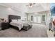 Spacious main bedroom with trey ceilings, fireplace and a decorative accent wall at 1213 Grande Vw, Loganville, GA 30052