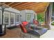 Covered patio includes comfortable seating and access to backyard at 1213 Grande Vw, Loganville, GA 30052