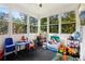 Sun-filled playroom with expansive windows and an assortment of colorful toys at 1213 Grande Vw, Loganville, GA 30052