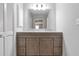Bathroom with double sink vanity with large mirror and storage, plus neutral paint throughout at 155 N Fayette Dr, Fayetteville, GA 30214