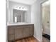 Neutral bathroom features a double sink vanity, updated fixtures, and adjacent tub and shower at 155 N Fayette Dr, Fayetteville, GA 30214