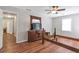 Bedroom featuring wood flooring, natural lighting, and neutral walls at 155 N Fayette Dr, Fayetteville, GA 30214