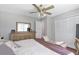 Bedroom featuring a bed with neutral bedding, wood floors, and a ceiling fan at 155 N Fayette Dr, Fayetteville, GA 30214