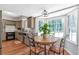 Charming breakfast nook adjacent to the kitchen with a large bay window overlooking greenery at 155 N Fayette Dr, Fayetteville, GA 30214