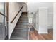 Bright foyer with hardwood floors and a staircase leading to the upper level at 155 N Fayette Dr, Fayetteville, GA 30214