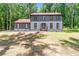 Charming two-story home featuring gray siding, black trim, and a well-maintained lawn at 155 N Fayette Dr, Fayetteville, GA 30214