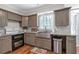 Modern kitchen with updated stainless steel appliances, granite countertops, and stylish cabinetry at 155 N Fayette Dr, Fayetteville, GA 30214