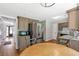 Cozy kitchen with stainless steel refrigerator and open floor plan at 155 N Fayette Dr, Fayetteville, GA 30214