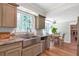 Bright kitchen featuring stainless steel appliances, granite countertops, and a dining nook with lots of natural light at 155 N Fayette Dr, Fayetteville, GA 30214