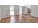 Bright living room with hardwood floors and ample natural light from two large windows at 155 N Fayette Dr, Fayetteville, GA 30214