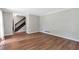 Spacious living room with hardwood floors and staircase access to the second floor at 155 N Fayette Dr, Fayetteville, GA 30214