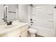 Bright bathroom with a white vanity, shower-tub combo, and modern fixtures at 229 Traditions Drive Southeast Dr, Loganville, GA 30052